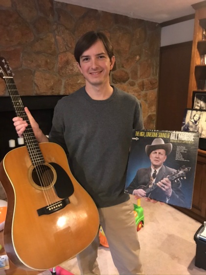 Cameron Connah with the Martin guitar given to him by Uncle Paul